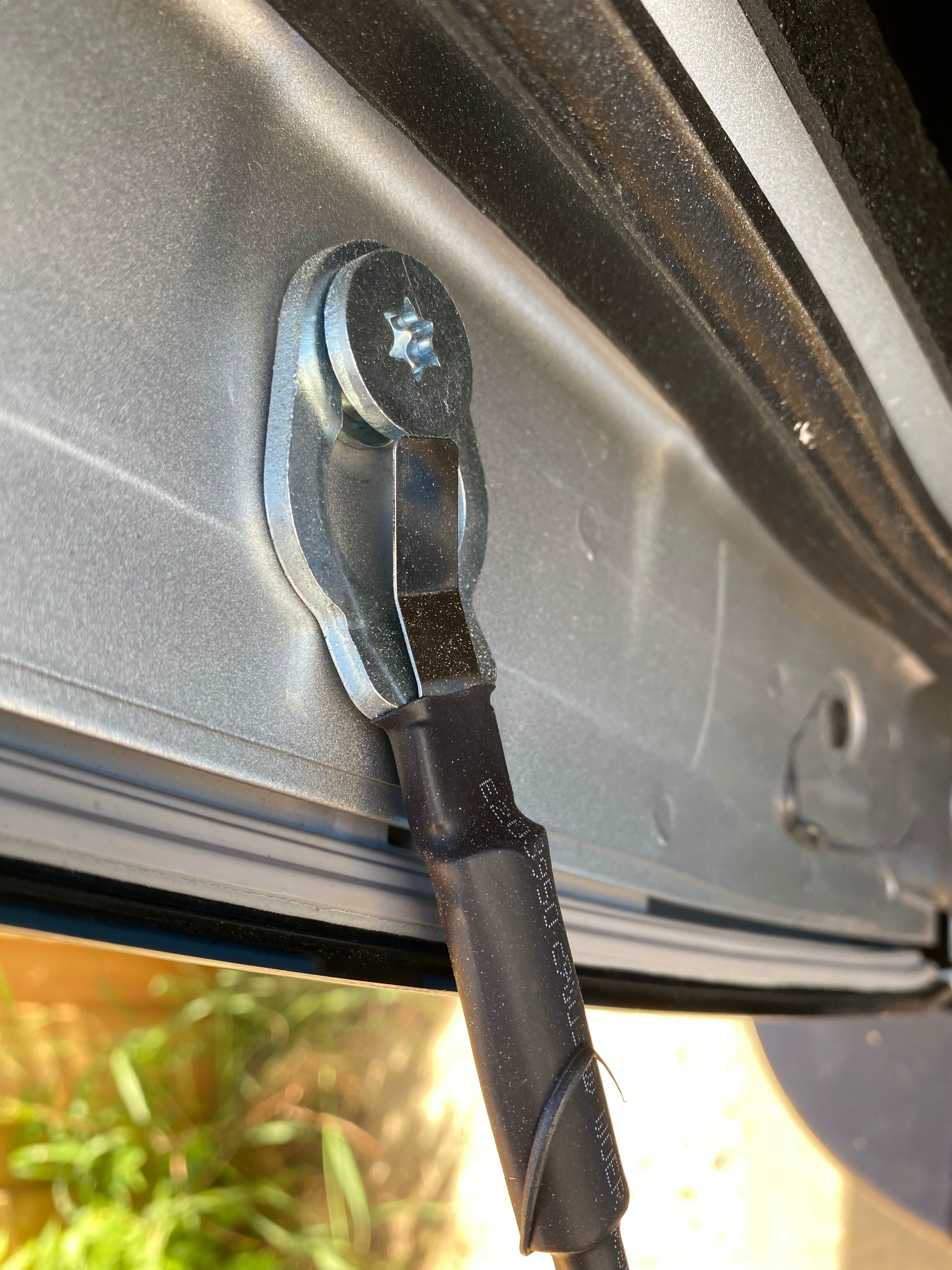 Dodge tailgate cable bolts installed